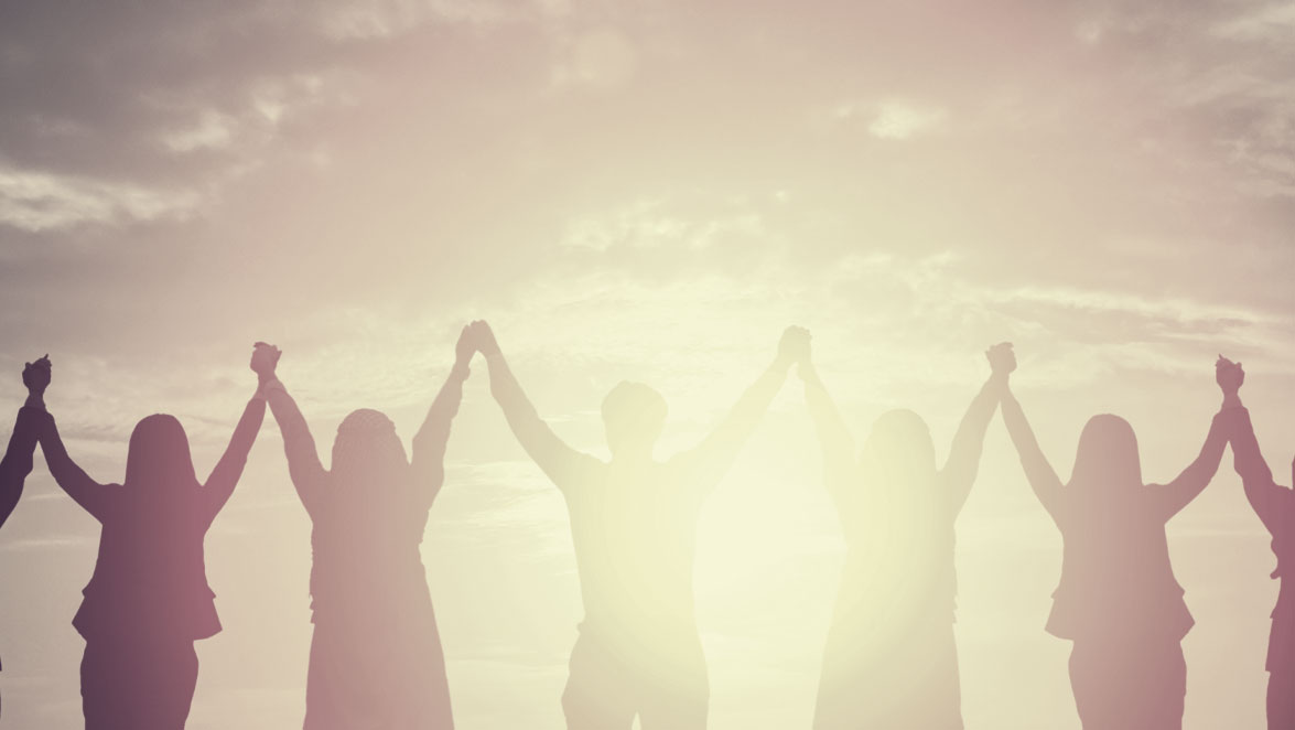 stock photo image of people holding hands with arms raised