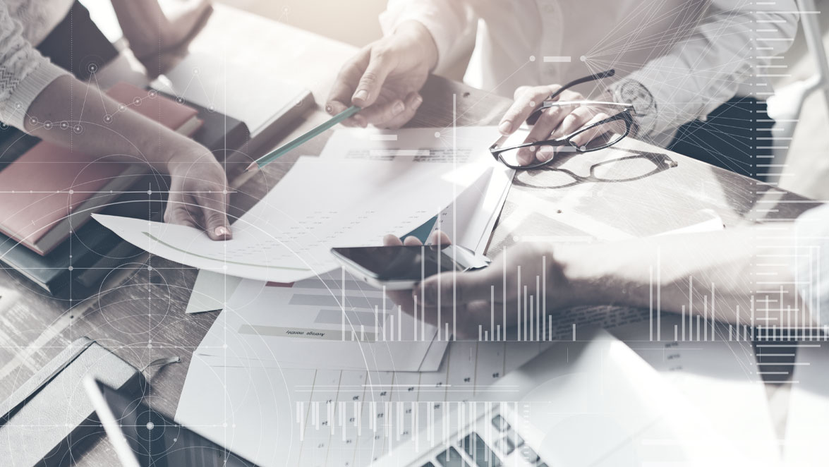 stockphoto composition hands on documents around a table
