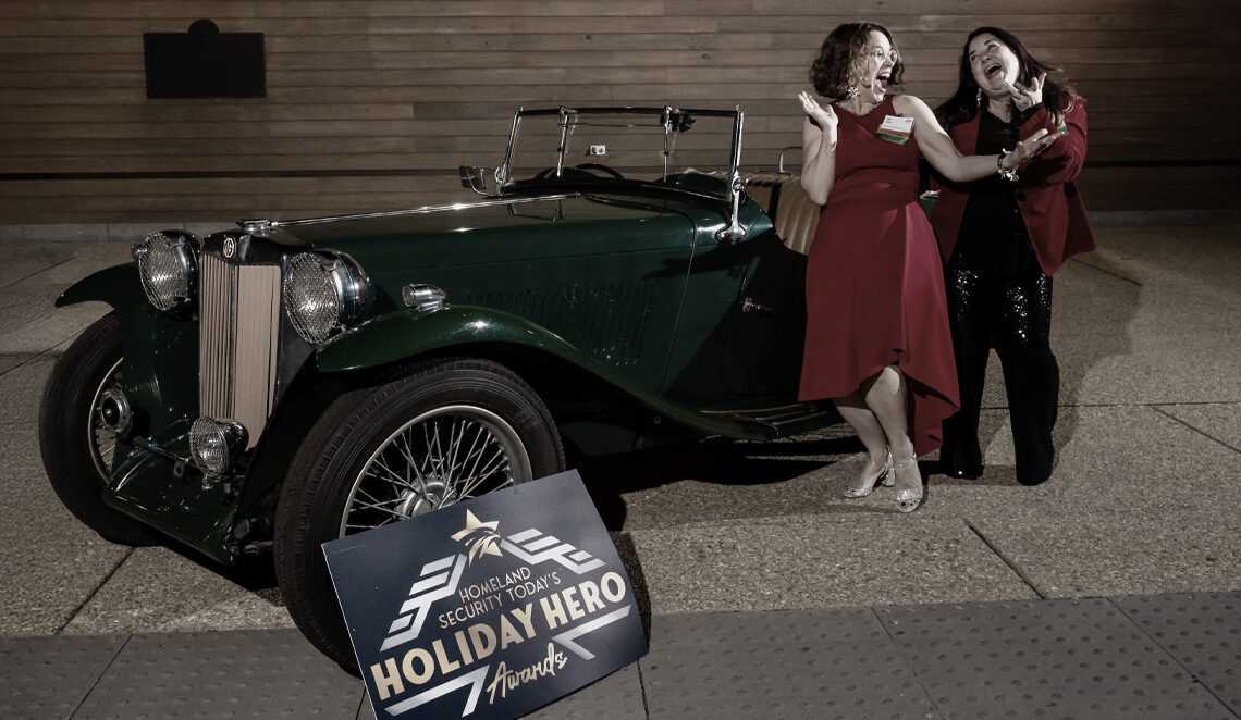 photo vintage car with two people alongside