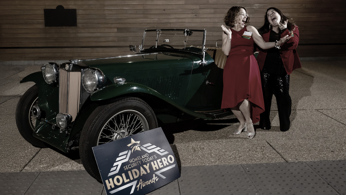 photo vintage car with two people alongside